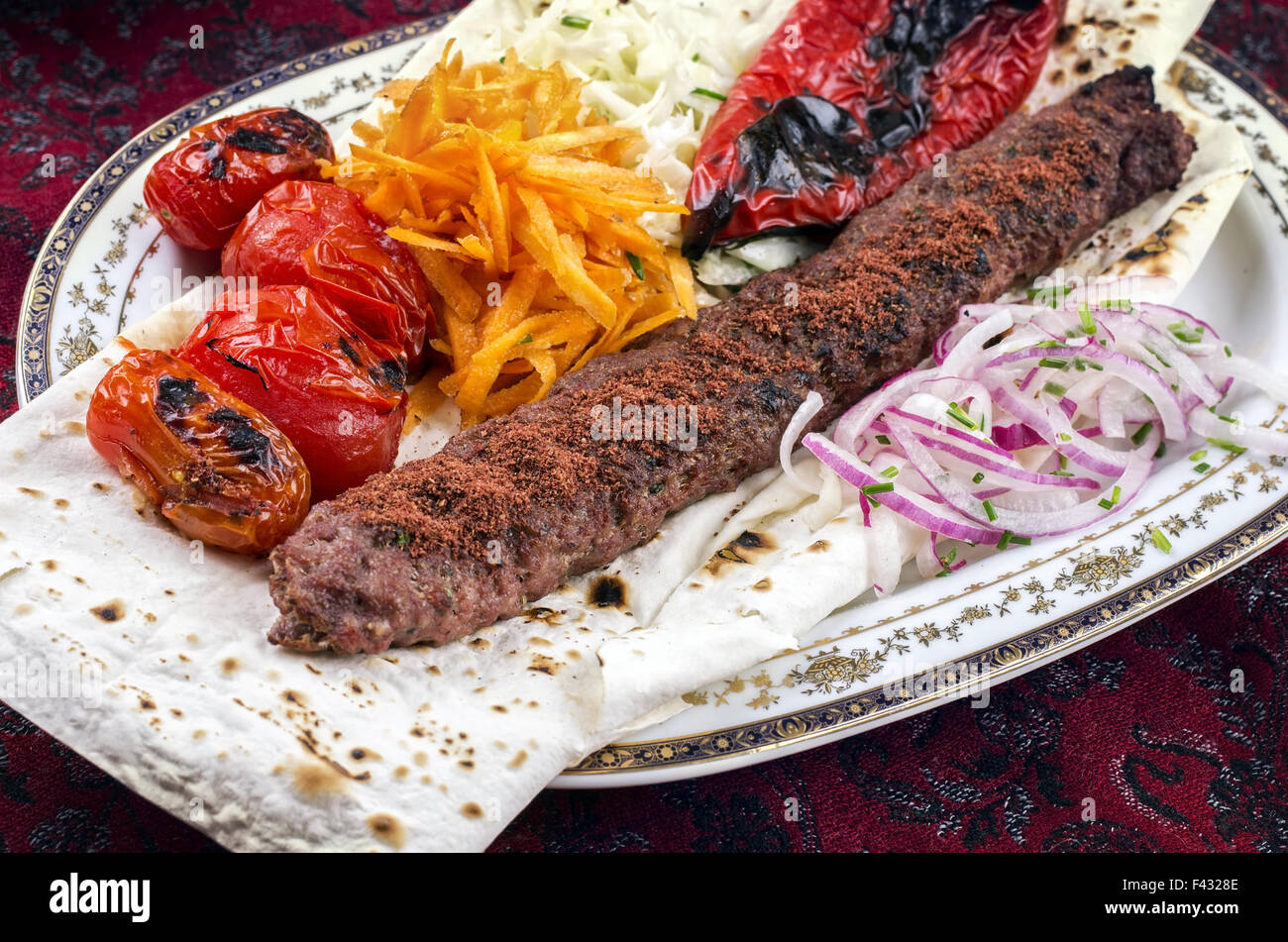 grilled lamb koobideh with vegetables Stock Photo