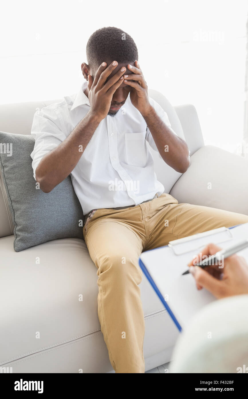 Upset Notes Therapist taking notes on her upset patient Stock Photo - Alamy