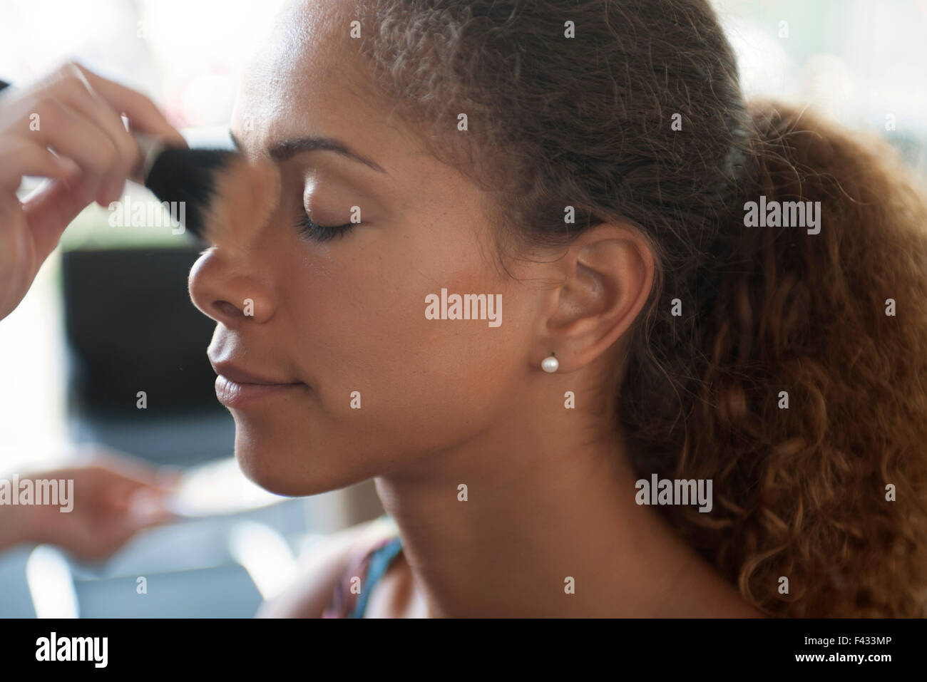 Applying face powder Stock Photo