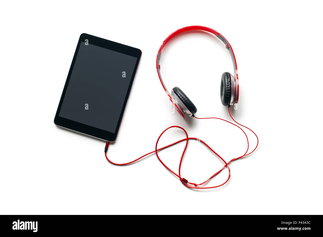 computer tablet with headphones on white background Stock Photo