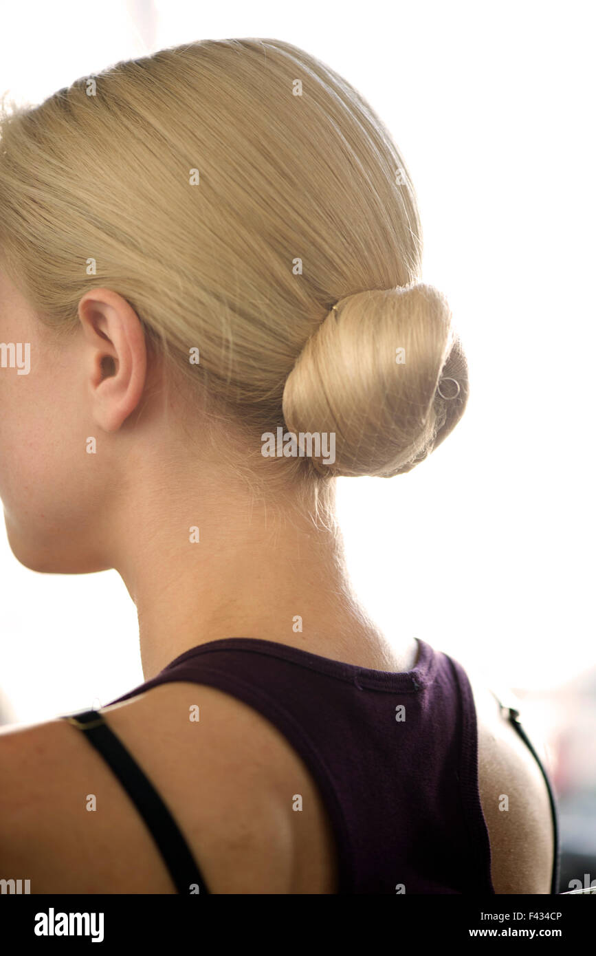 Woman with hair arranged in a chignon Stock Photo