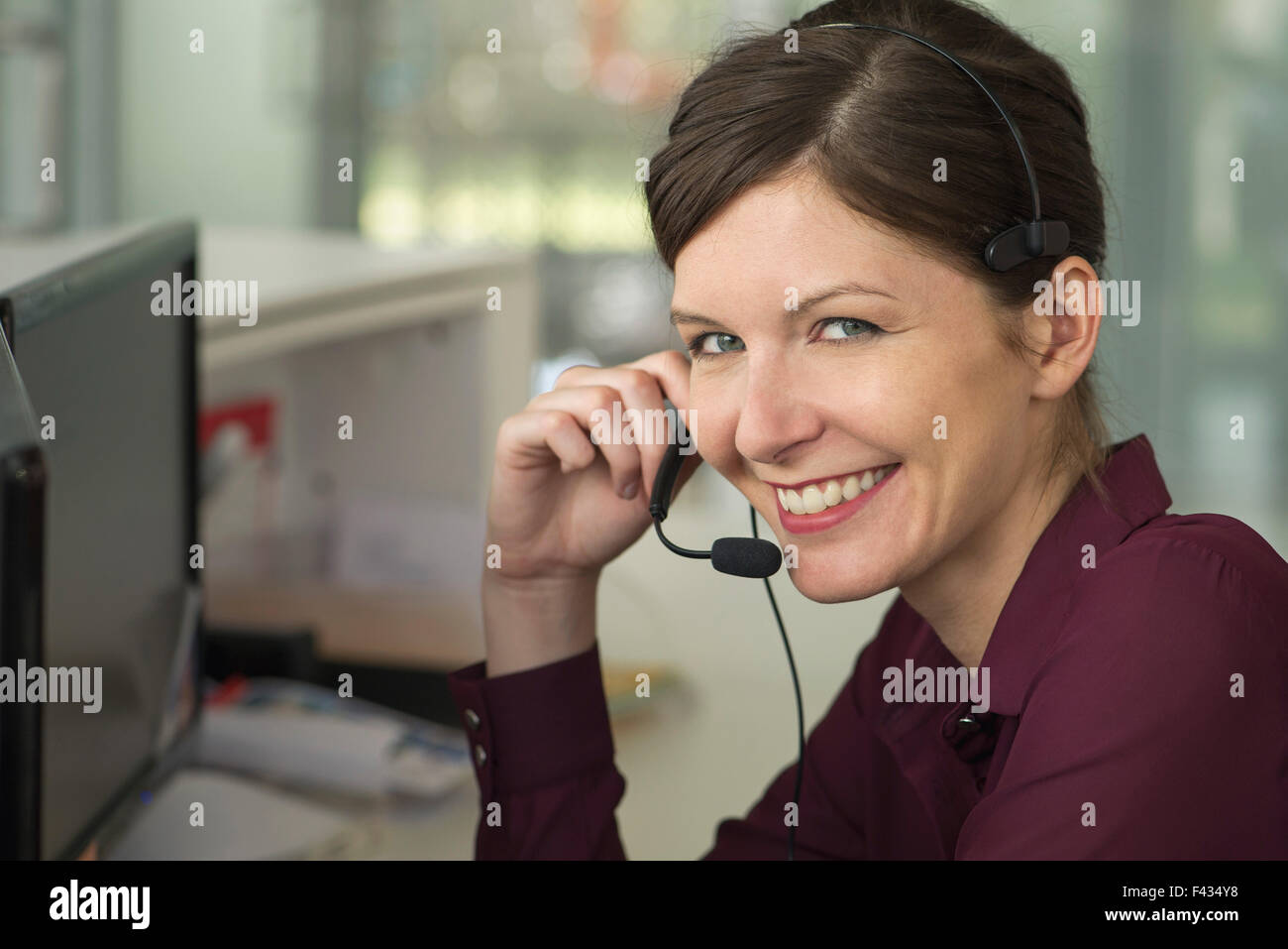 Office worker making phone call using handsfree device Stock Photo Alamy
