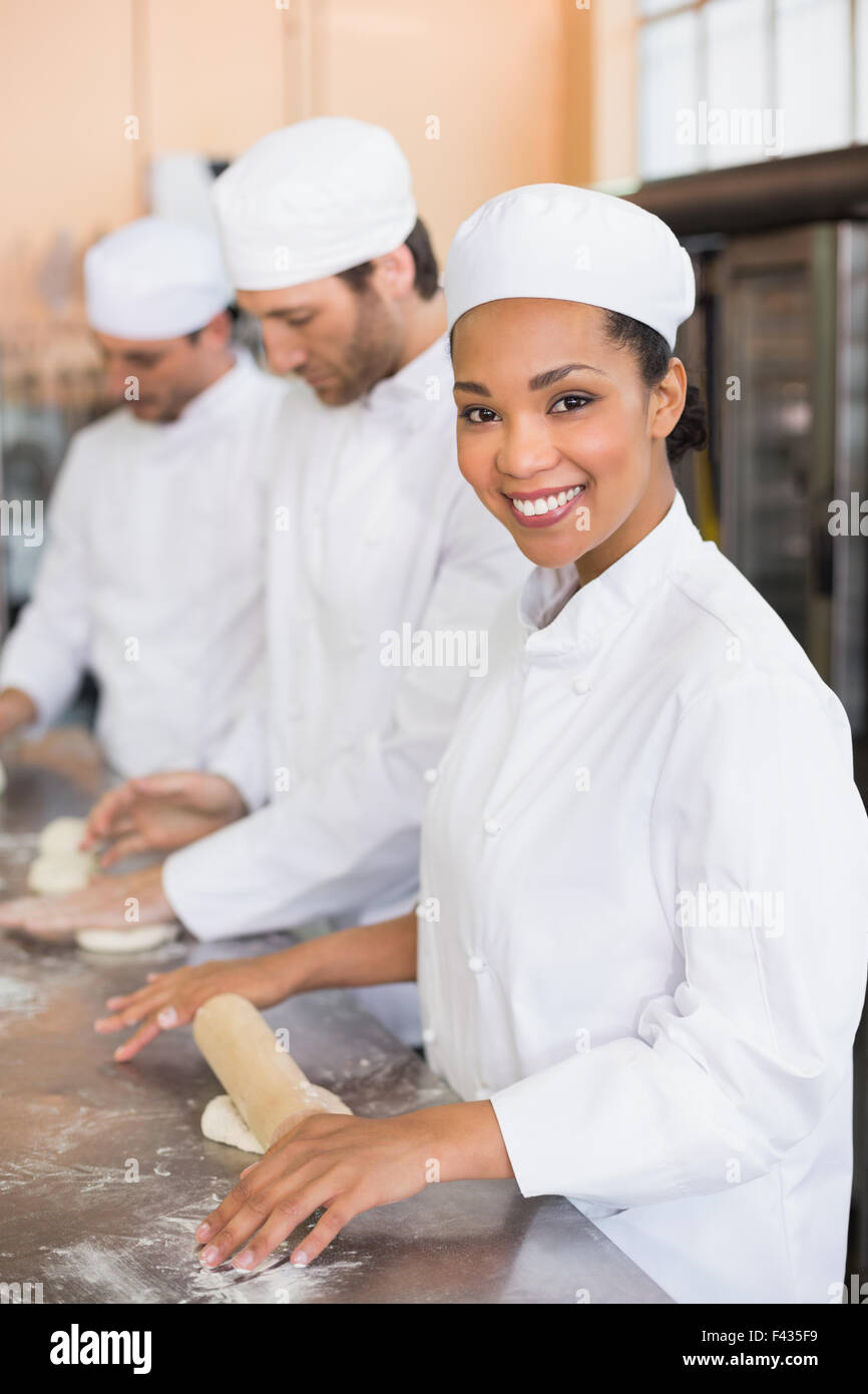 Team of bakers working at counter Stock Photo Alamy