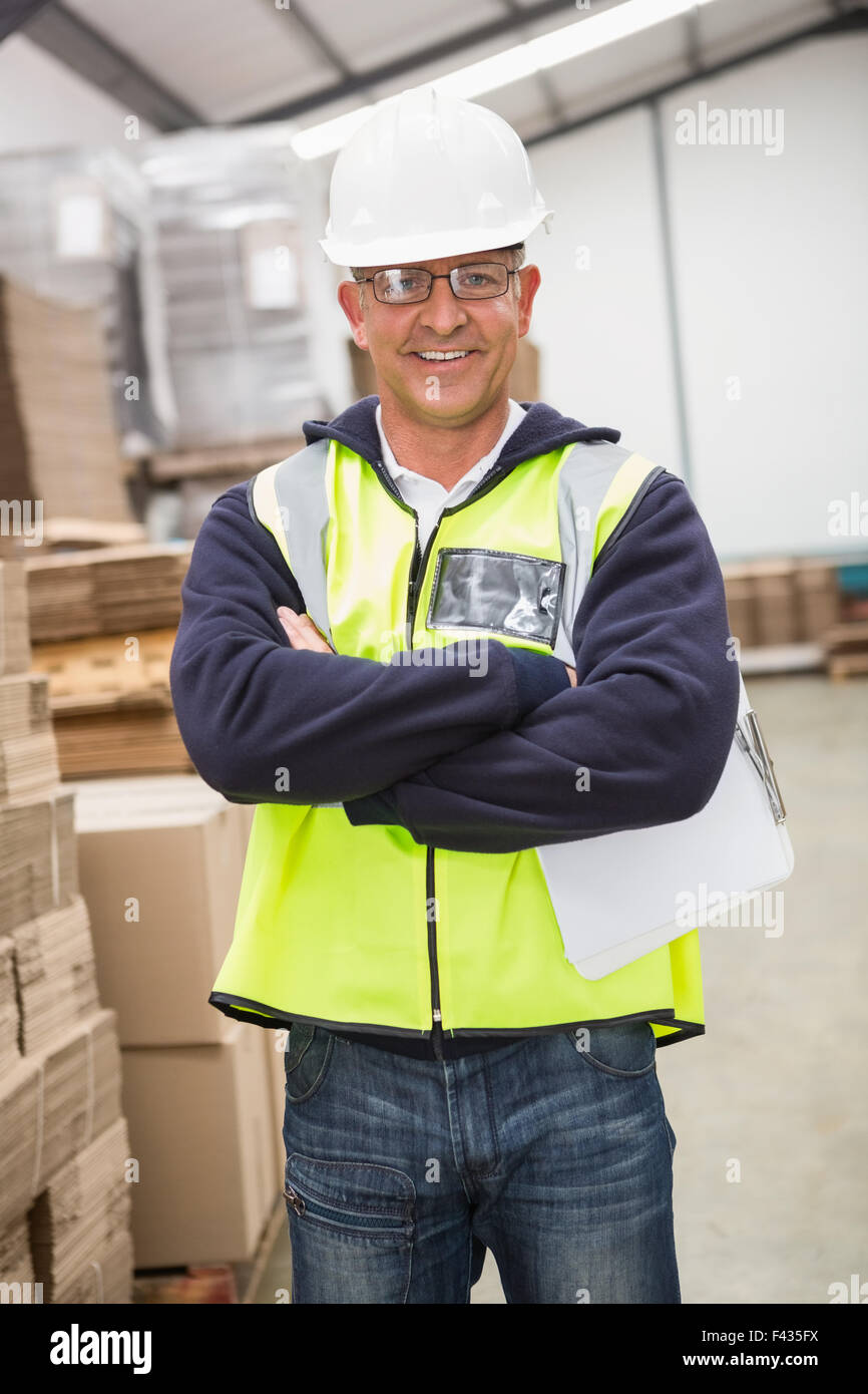 Worker wearing hard hat in warehouse Stock Photo Alamy