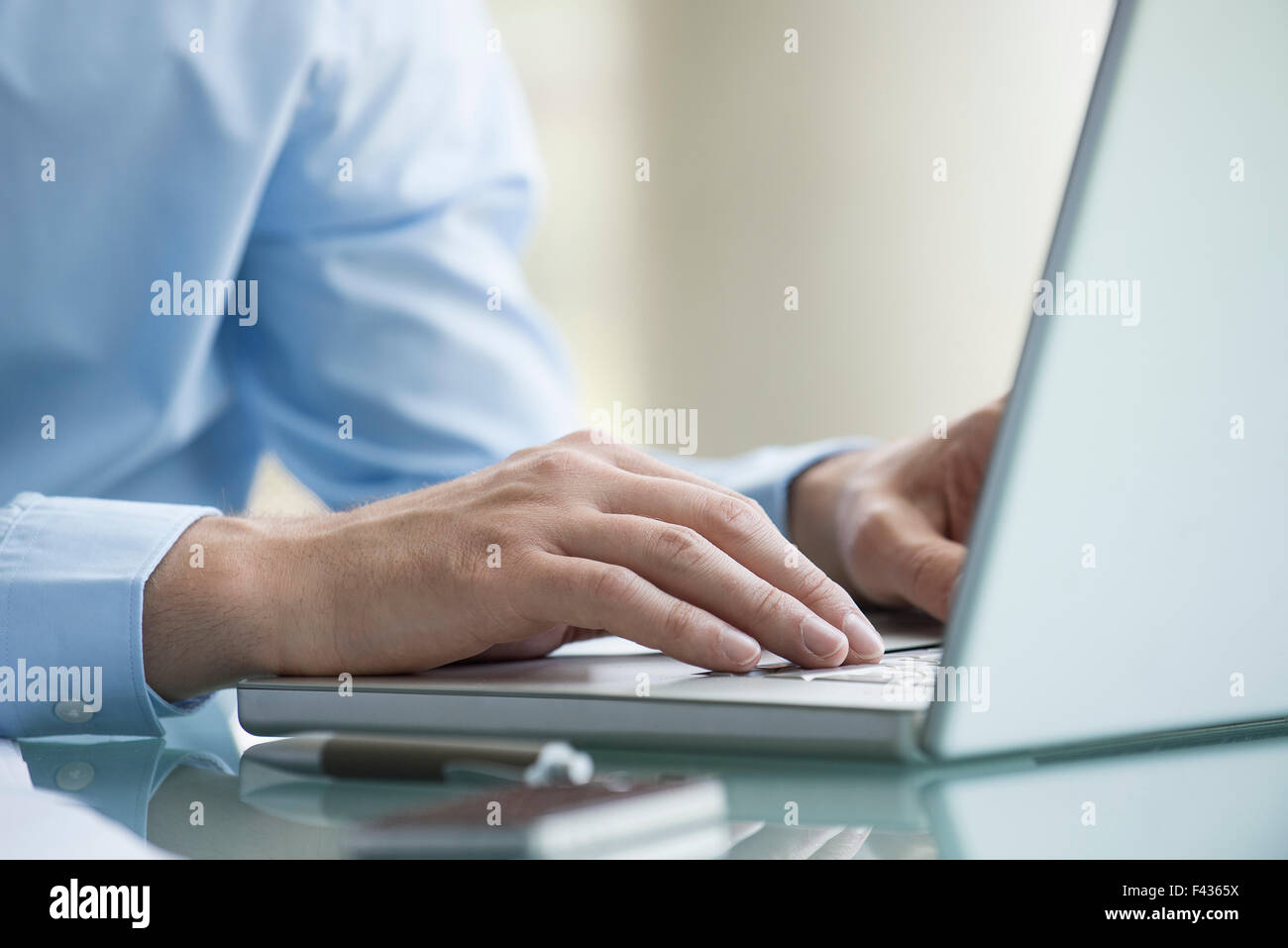 Man using laptop computer Stock Photo - Alamy