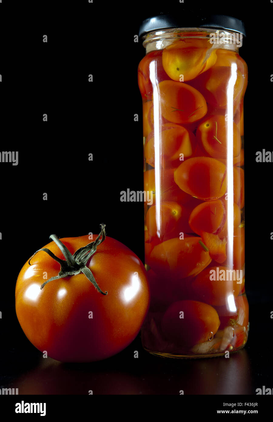 canned tomatoes in glass jars Stock Photo Alamy