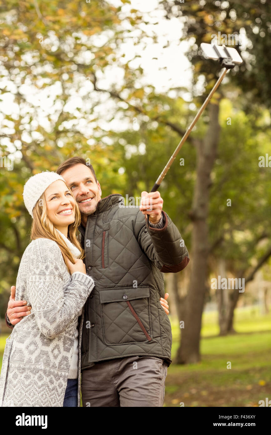 Smiling young couple taking selfies Stock Photo