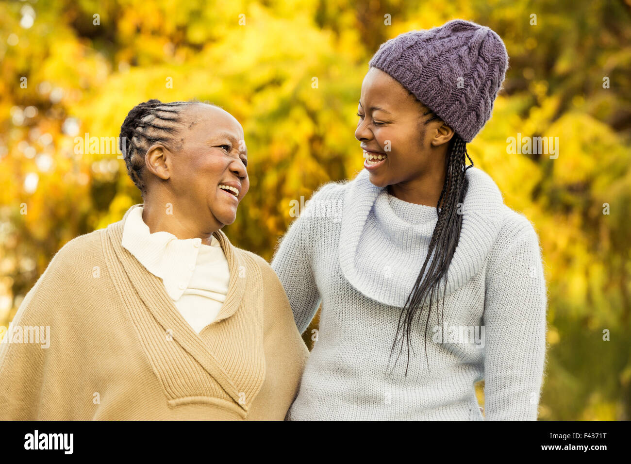 Mother and grandmother smiling to each other Stock Photo
