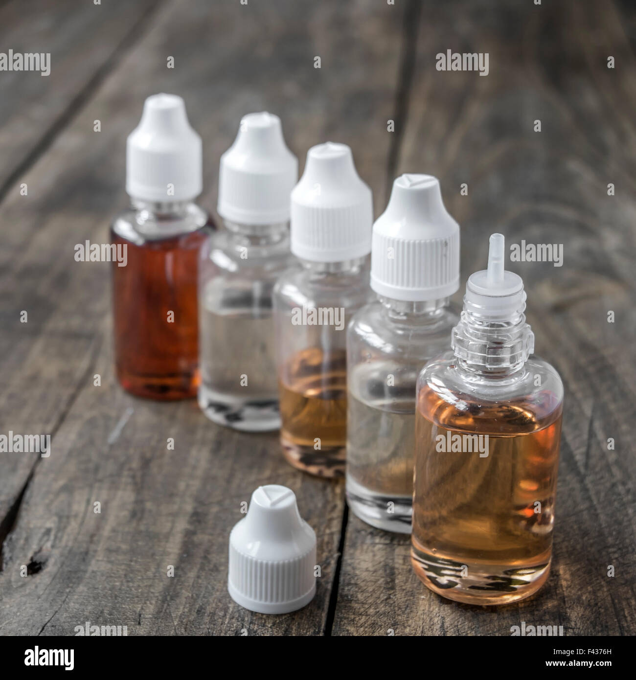 e-cigarettes , close up of  different re-fill bottles Stock Photo