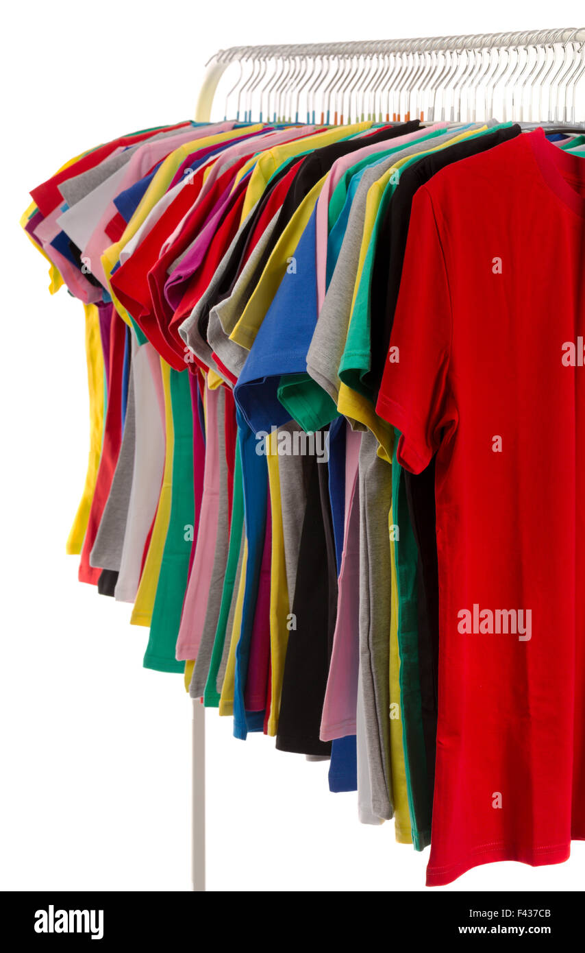 Colored shirts on hangers in a row. Stock Photo