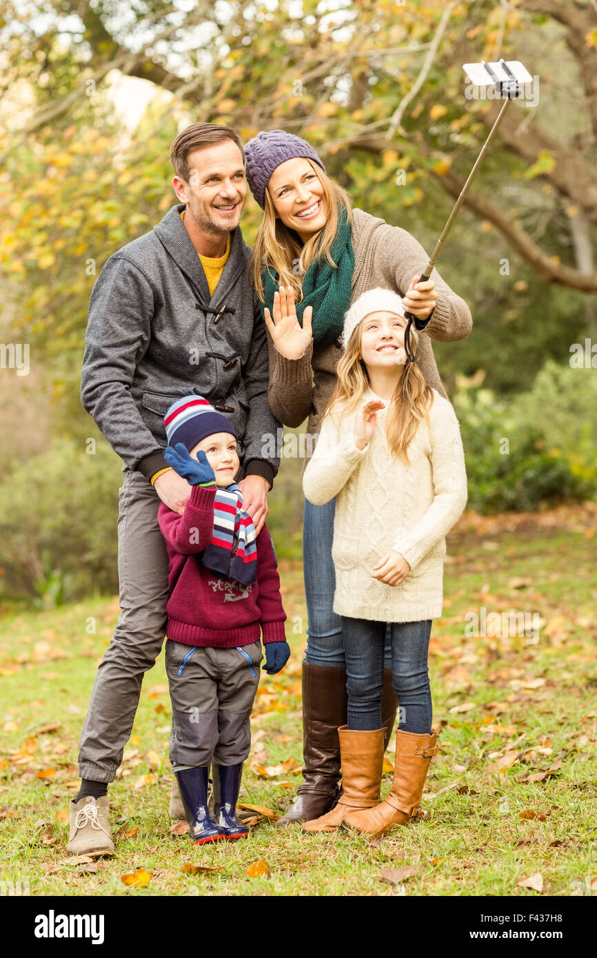 Smiling young family taking selfies Stock Photo