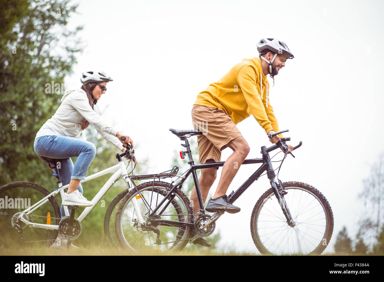 Happy Bike Ride Happy couple on a bike ride Stock Photo - Alamy