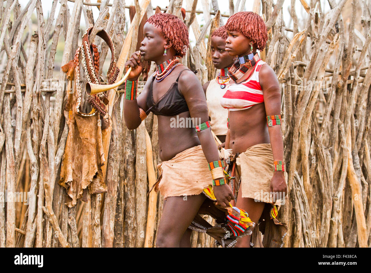 Hamer Women anxiously wait at the traditional whipping ritual. Omo Valley, Ethiopia Stock Photo