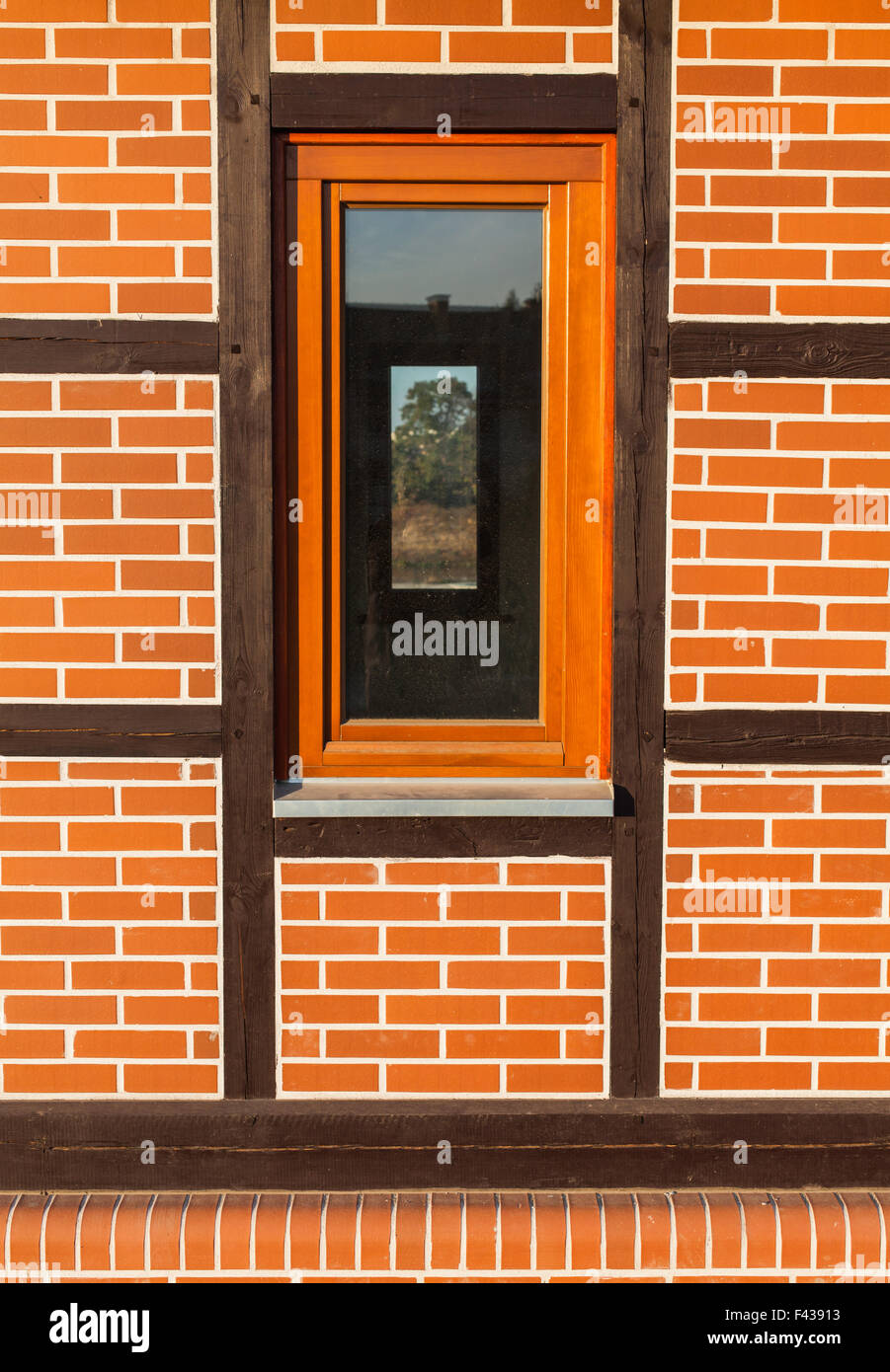 Background of renovated brick wall with window and wooden structure