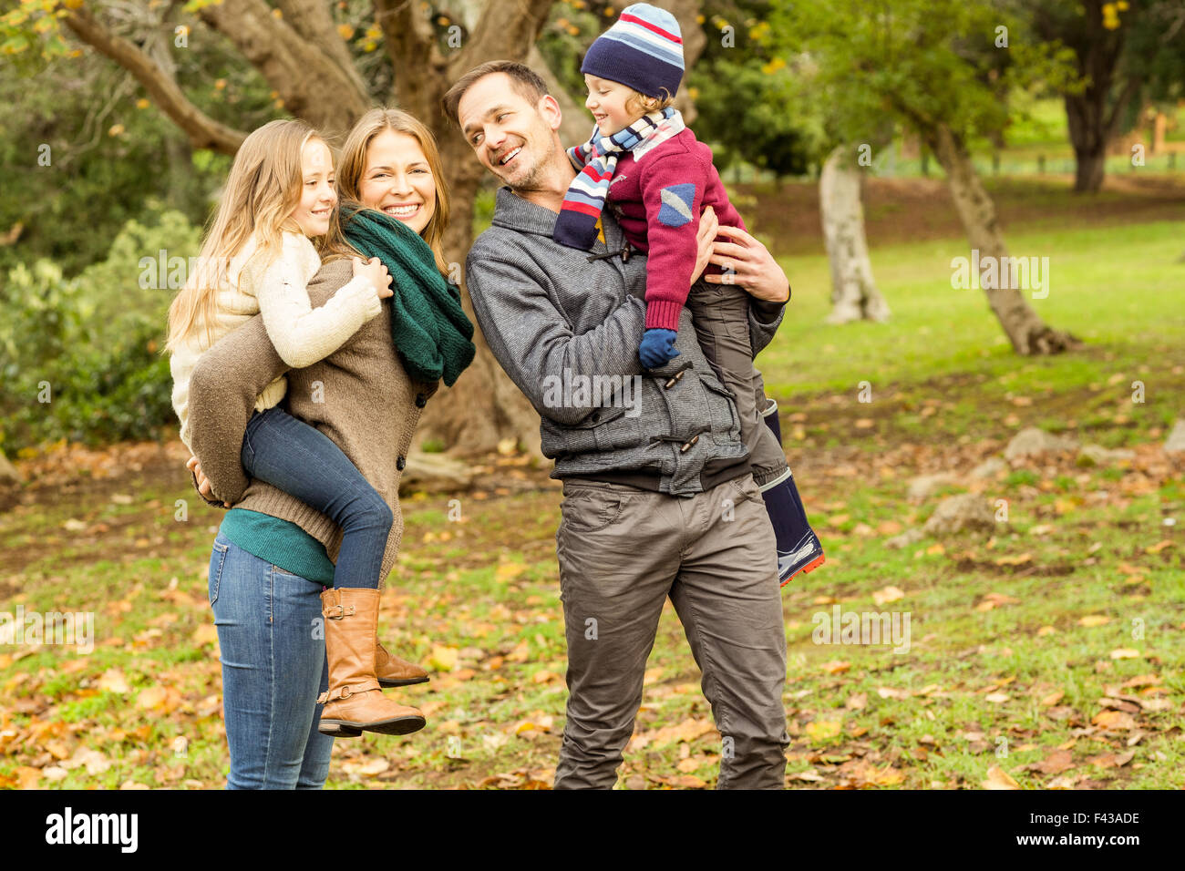 Smiling young family looking each other Stock Photo