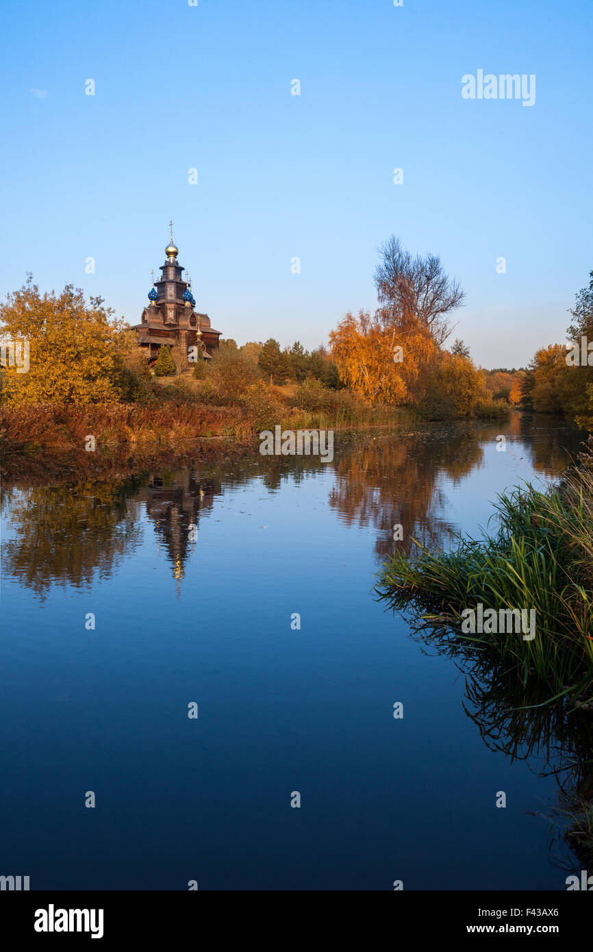 autumn landscape with a wooden church Stock Photo - Alamy
