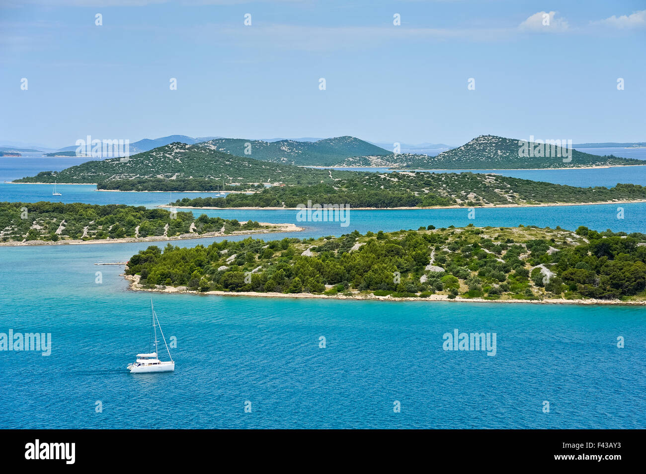 Sailing on sailboat with island in Croatia Stock Photo