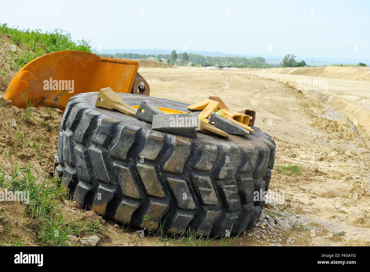 Spare tire with tool at construction site Stock Photo