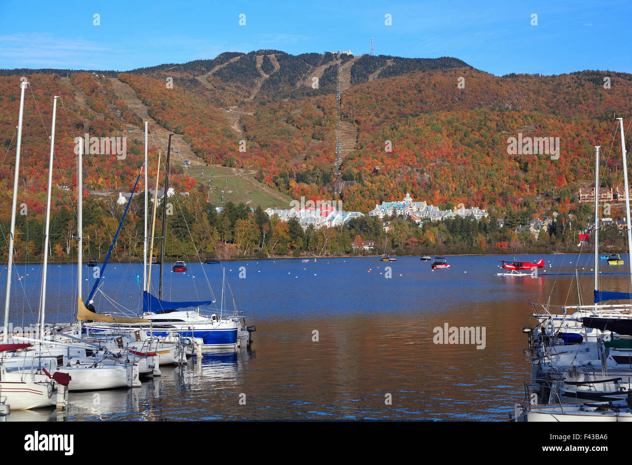mont-tremblant-lake-and-village-with-autumn-colors-quebec-stock-photo