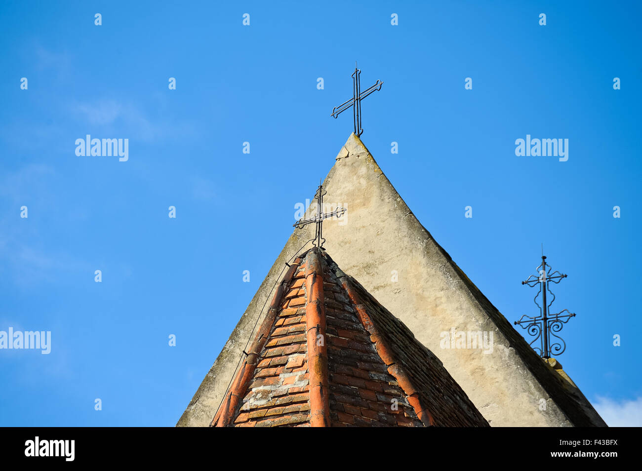 Three crosses on church roof Stock Photo