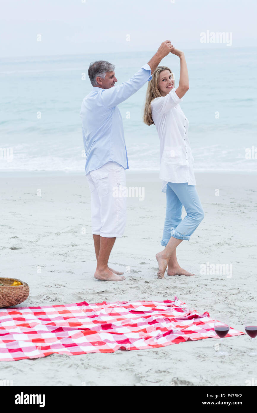 Happy couple dancing by the sea Stock Photo - Alamy