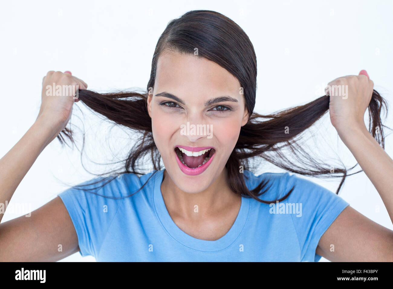 Furious woman pulling her hair Stock Photo