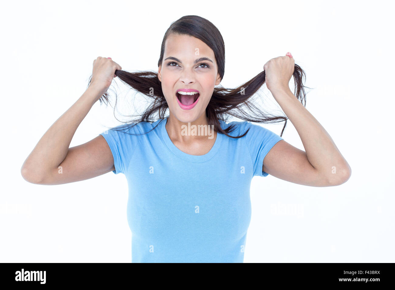 Furious woman pulling her hair Stock Photo