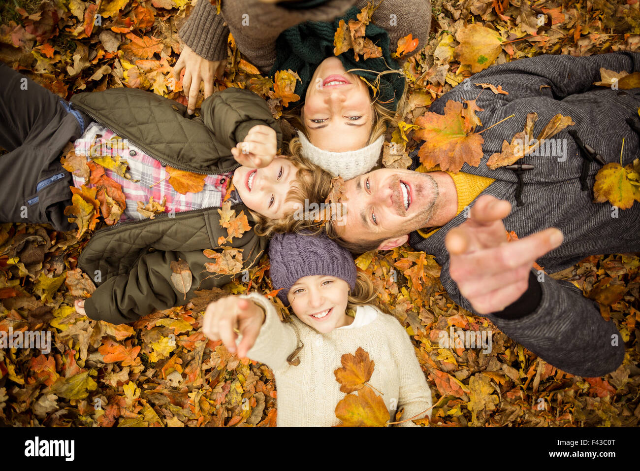 Smiling young family doing a head circles Stock Photo