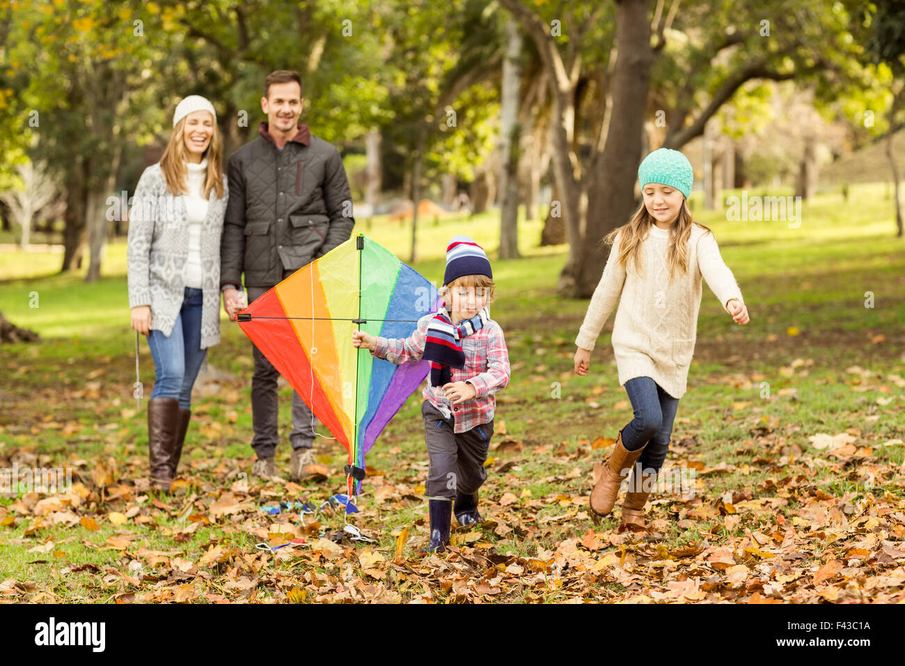 Young family playing with a kite Stock Photo