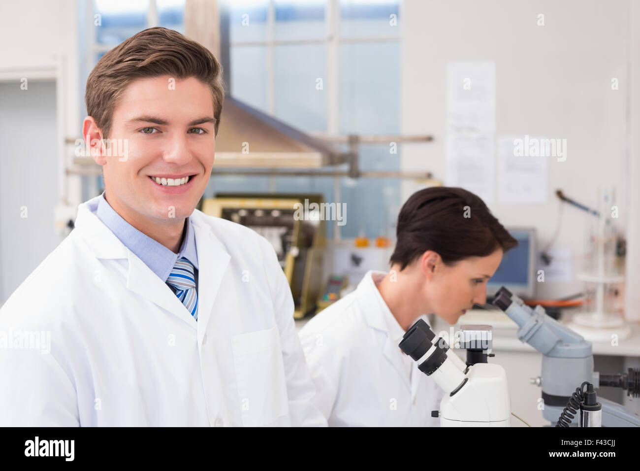 Scientists working with microscopes Stock Photo