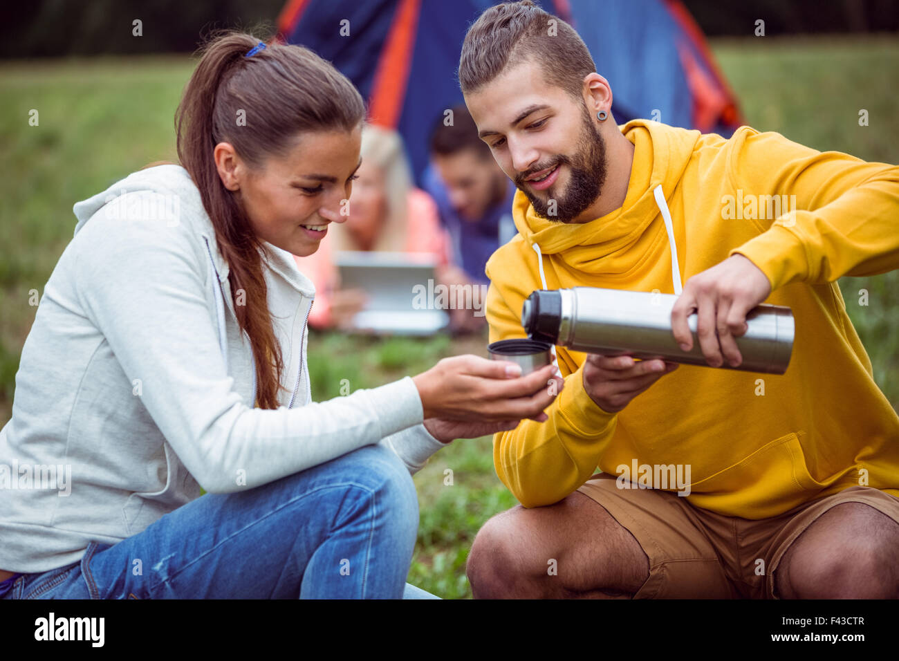 Happy friends on a camping trip Stock Photo