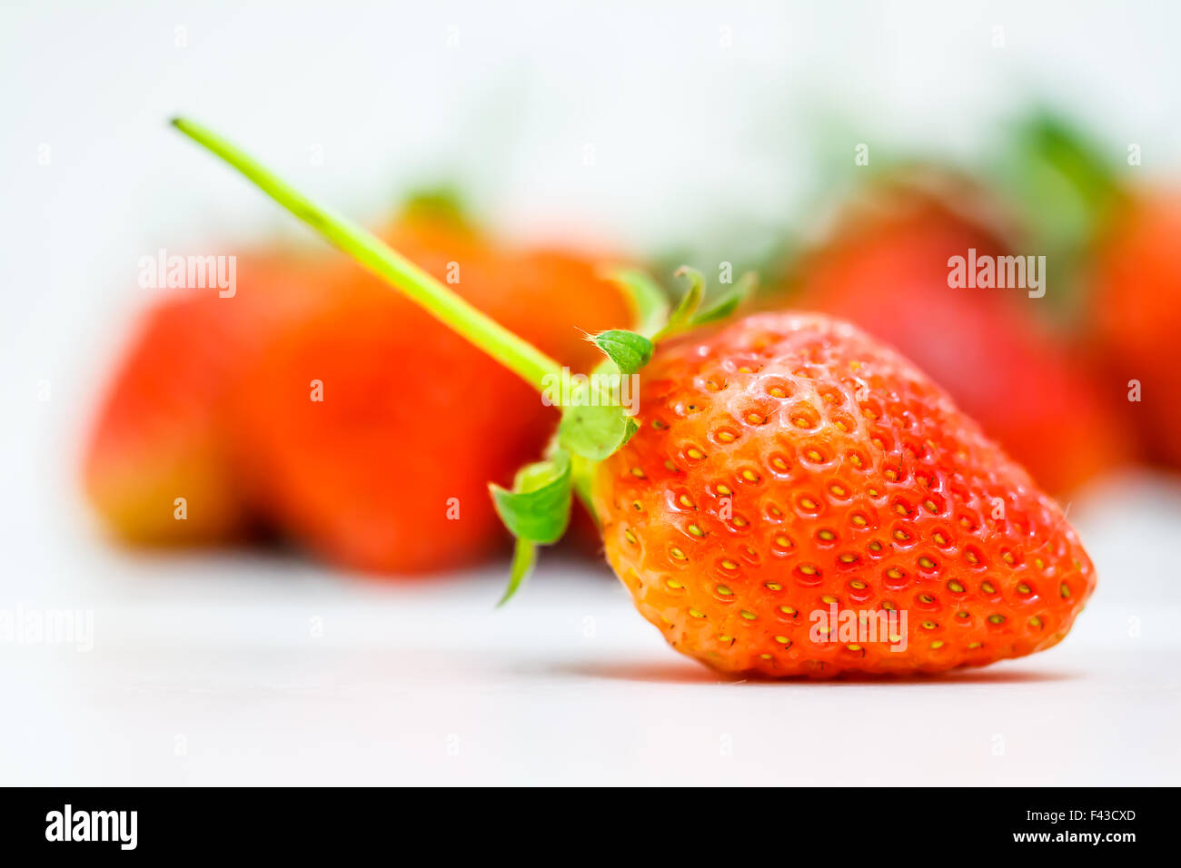 Strawberry berries on a white background Stock Photo - Alamy