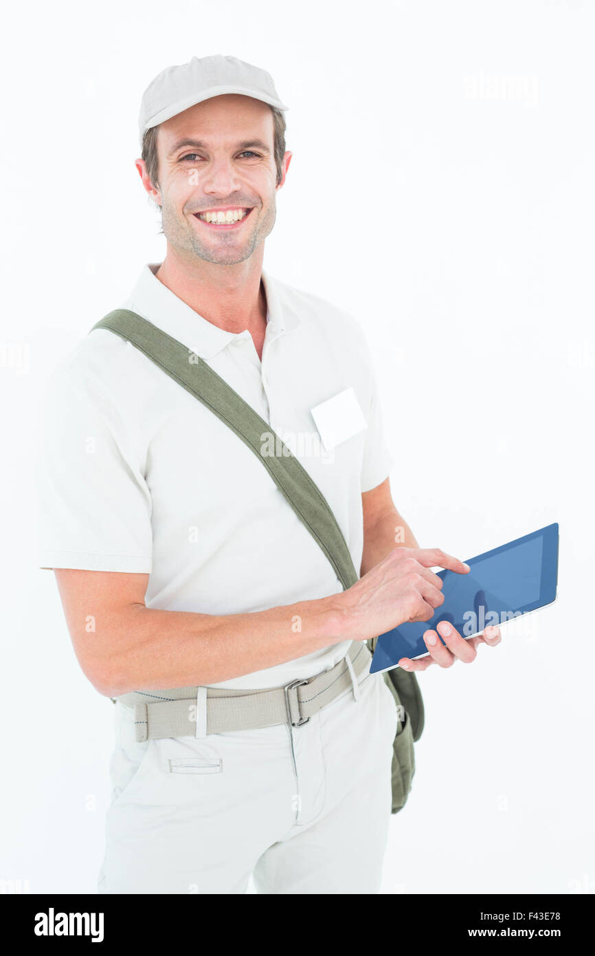 Happy delivery man using digital tablet Stock Photo - Alamy