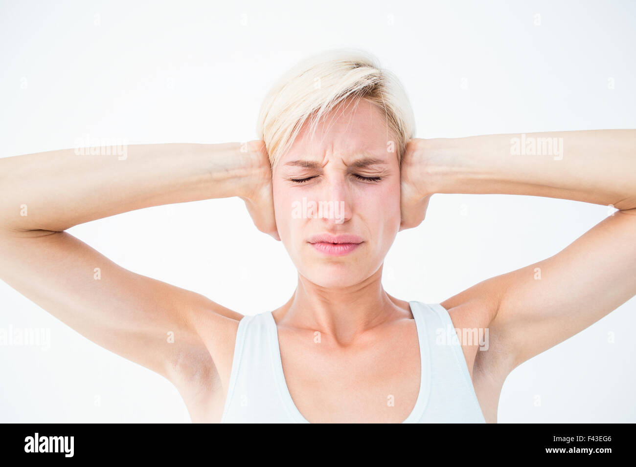 Upset woman covering her ears Stock Photo Alamy