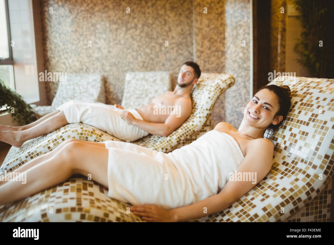 Man and woman lying down Stock Photo