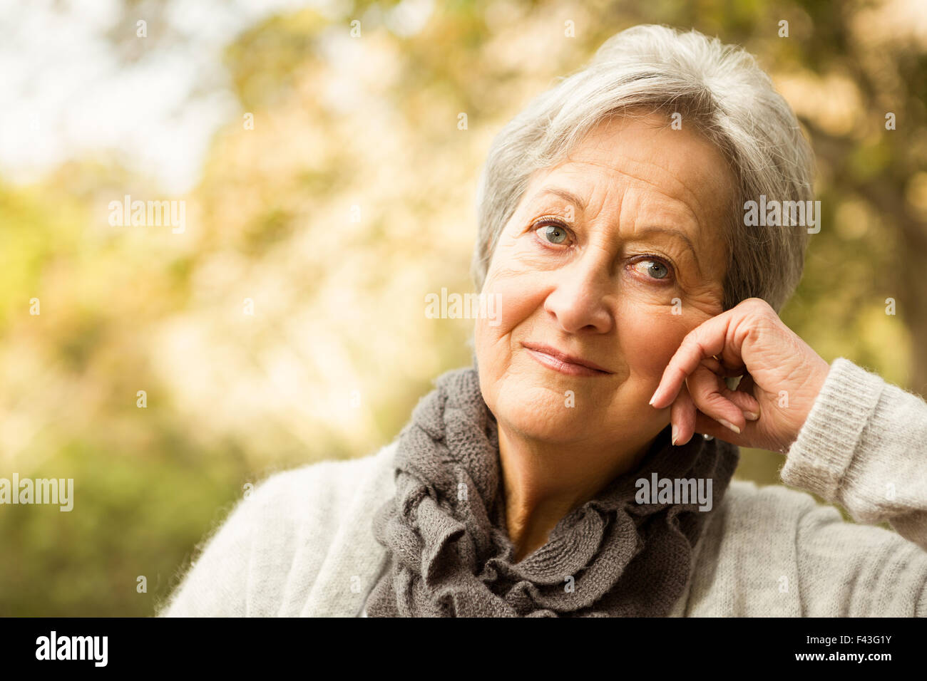 Senior woman in the park Stock Photo - Alamy