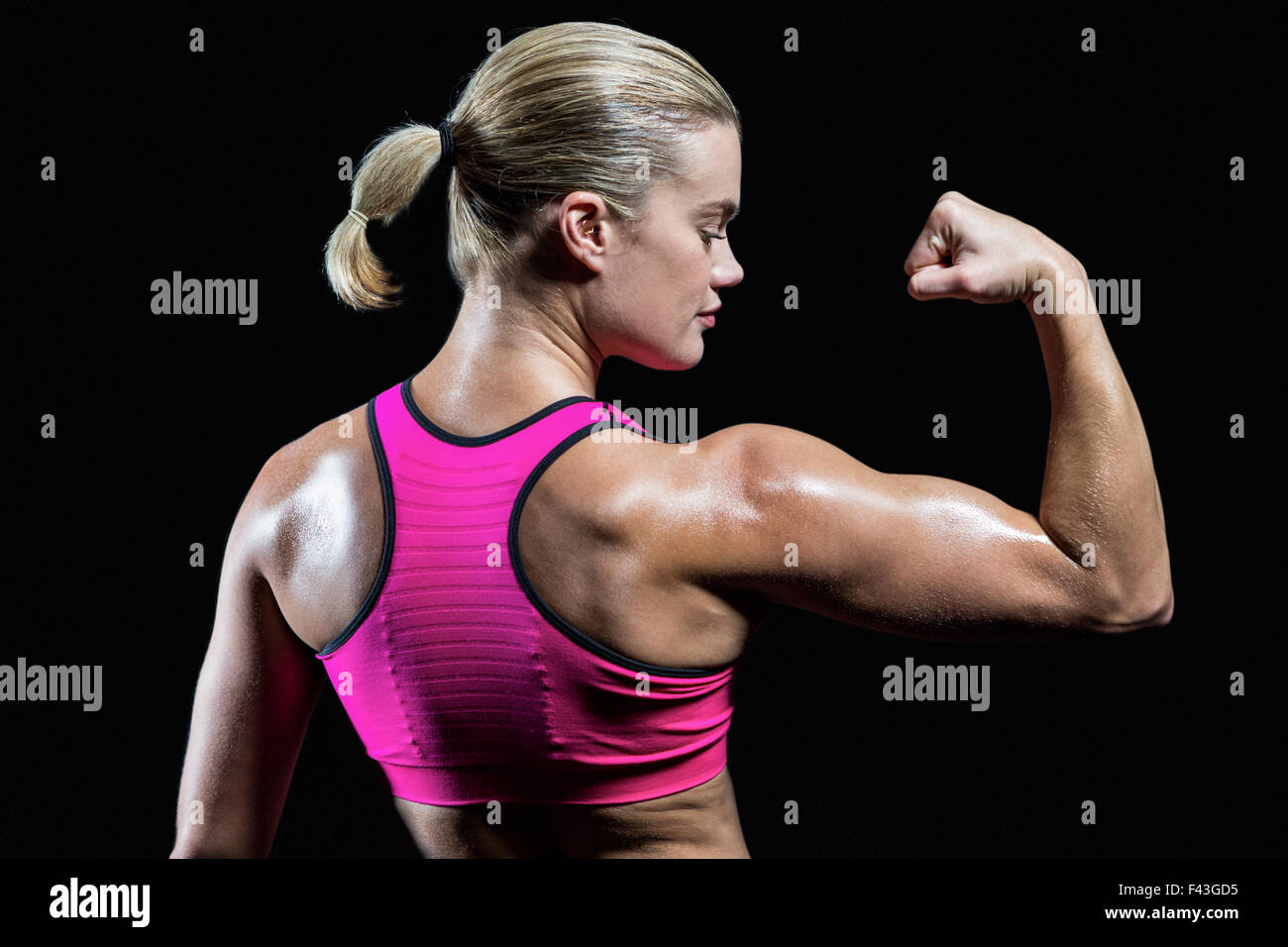 Muscular woman flexing her arm Stock Photo Alamy