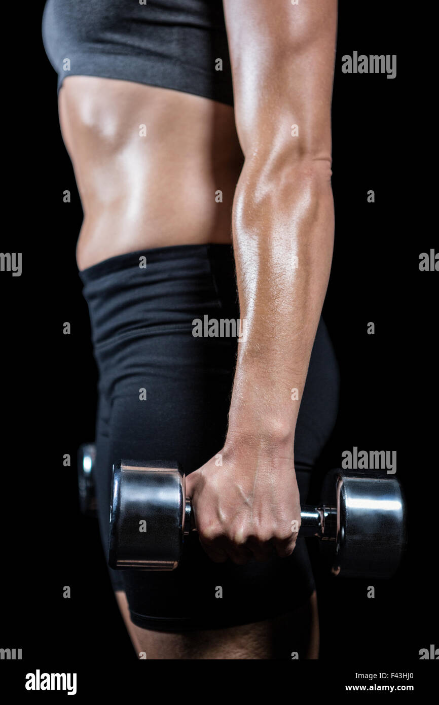 Muscular woman lifting heavy dumbbells Stock Photo Alamy