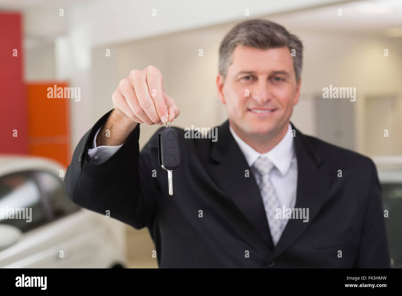 Car salesperson holding key hi-res stock photography and images - Alamy