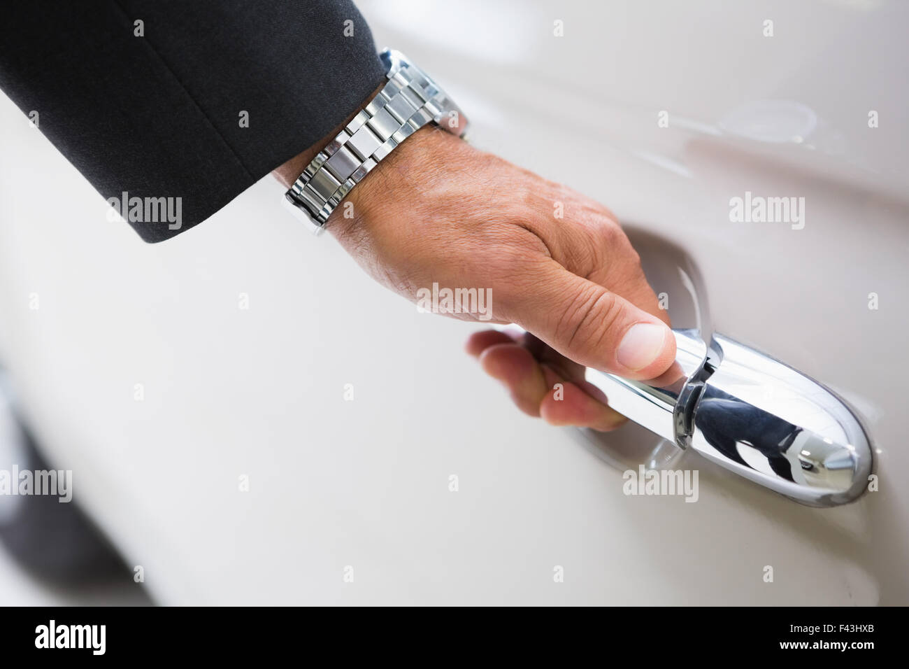Man holding a car door handles Stock Photo Alamy