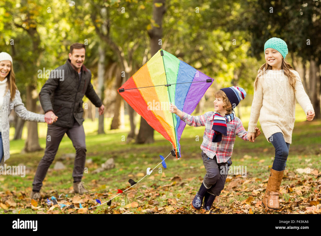 Young family playing with a kite Stock Photo