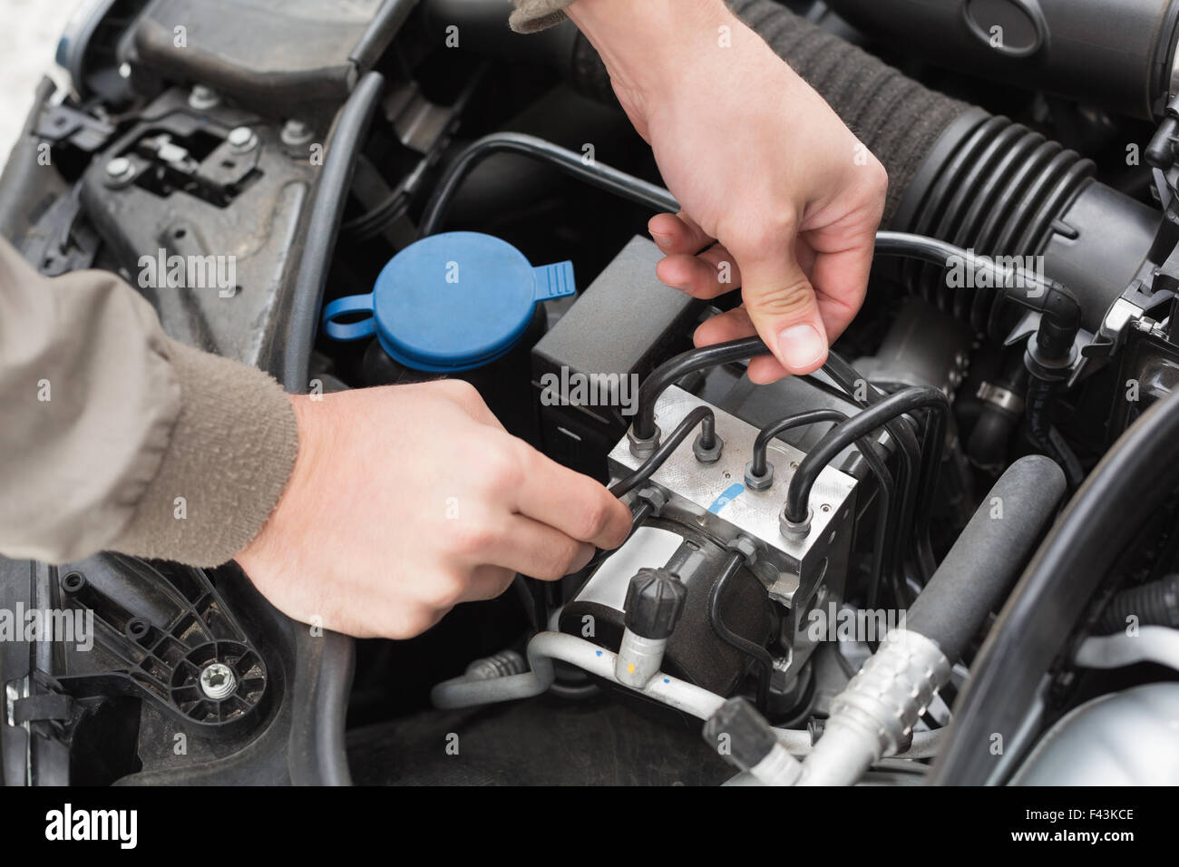 Man checking the engine of his car Stock Photo - Alamy