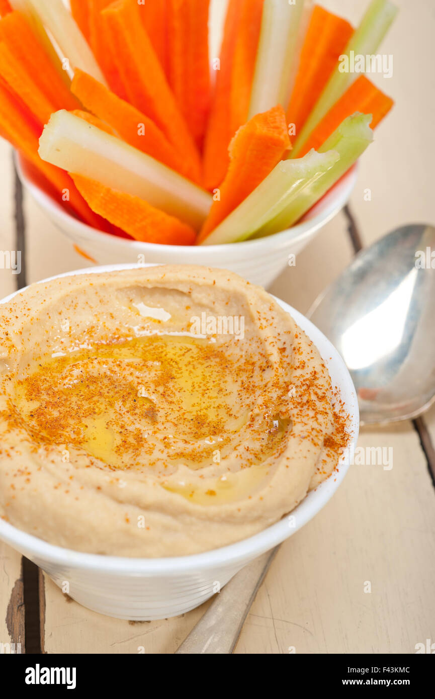 fresh hummus dip with raw carrot and celery Stock Photo