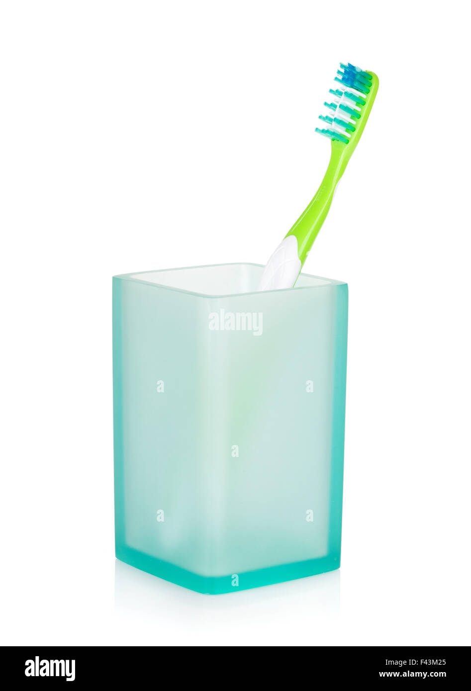 Toothbrush in a glass. Isolated on white background Stock Photo - Alamy