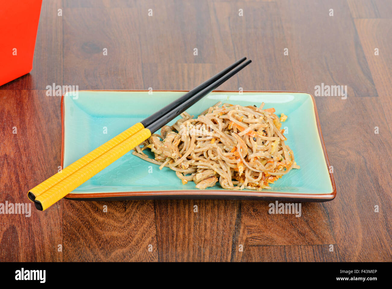 Meat and noodles in red take away container Stock Photo