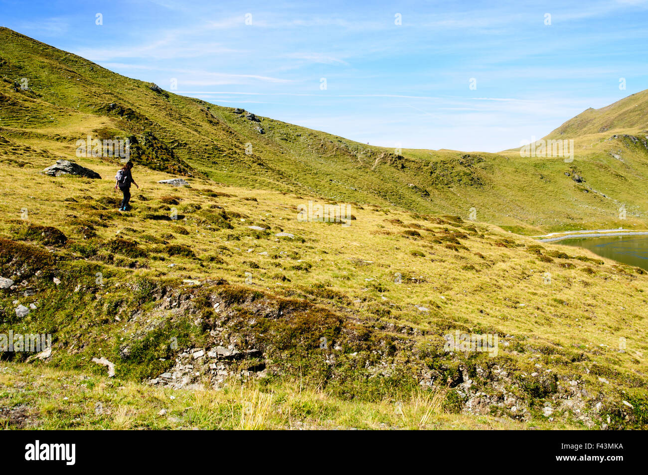 Female hiker on Konigsleiten mountain top. Zillertal, Tyrol, Austria ...