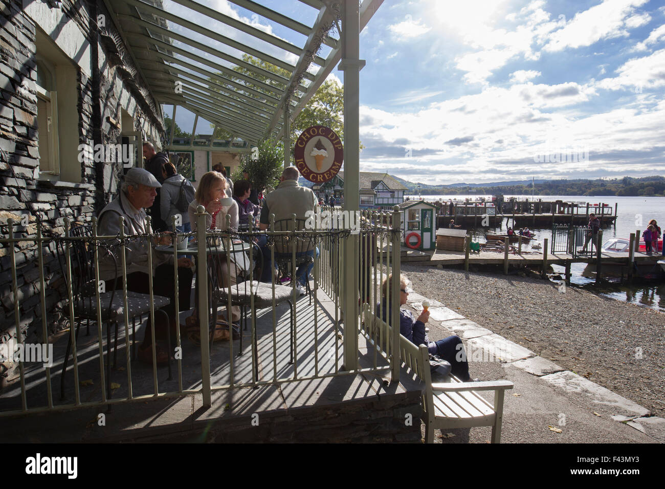 Lake Windermere Cumbria UK Wednesday  14th October 2015,  Sunny  afternoon  at Waterhead at the northern end of Lake Windermere .Showing autumnal colours  Afresco teas & ice cream at lakeside cafe  Credit:  Gordon Shoosmith/Alamy Live News Stock Photo