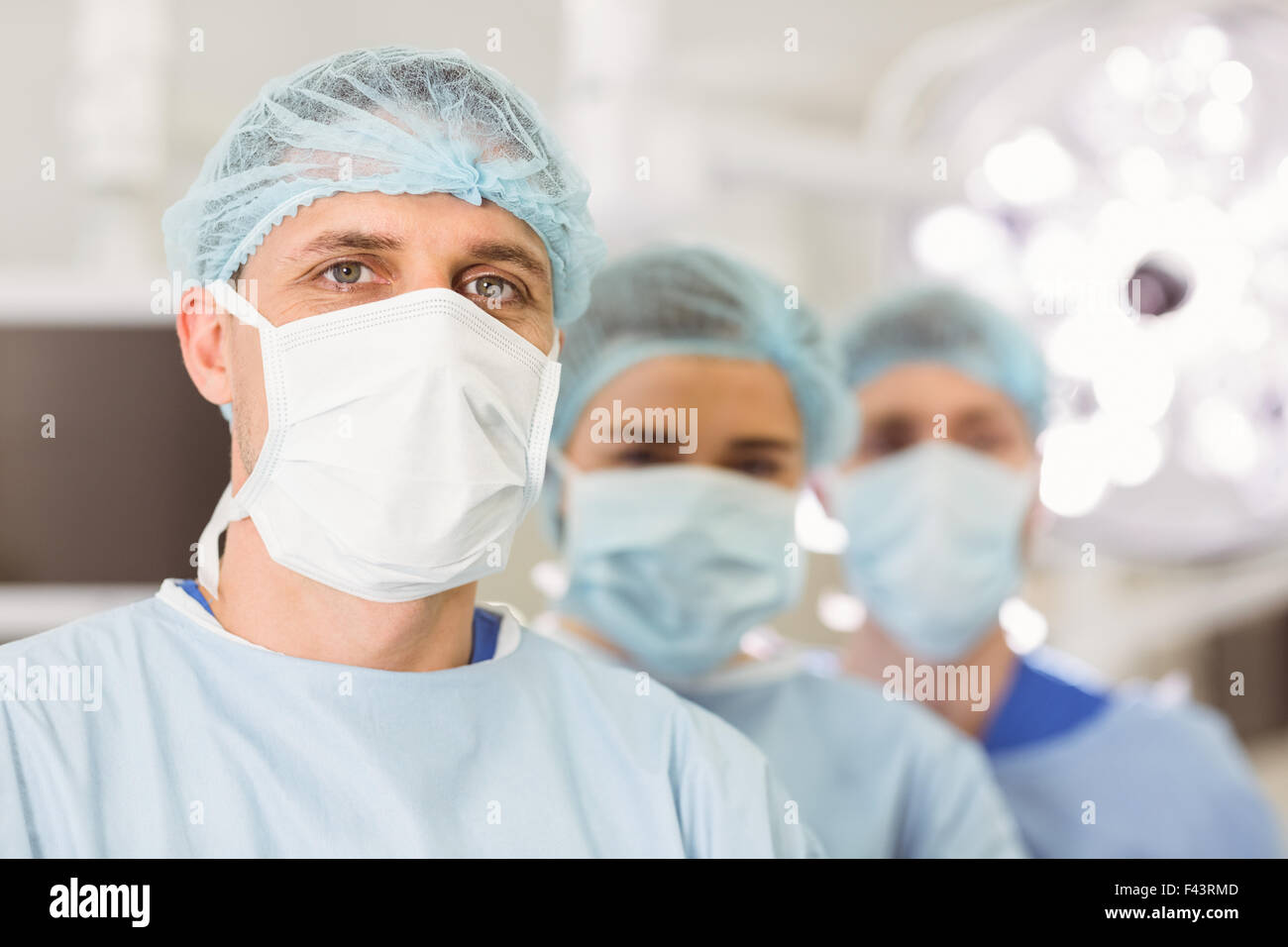 Team of surgeons looking at camera Stock Photo - Alamy