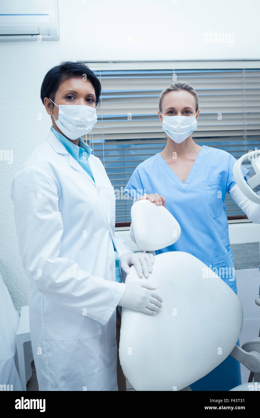 Female dentists wearing surgical masks Stock Photo Alamy
