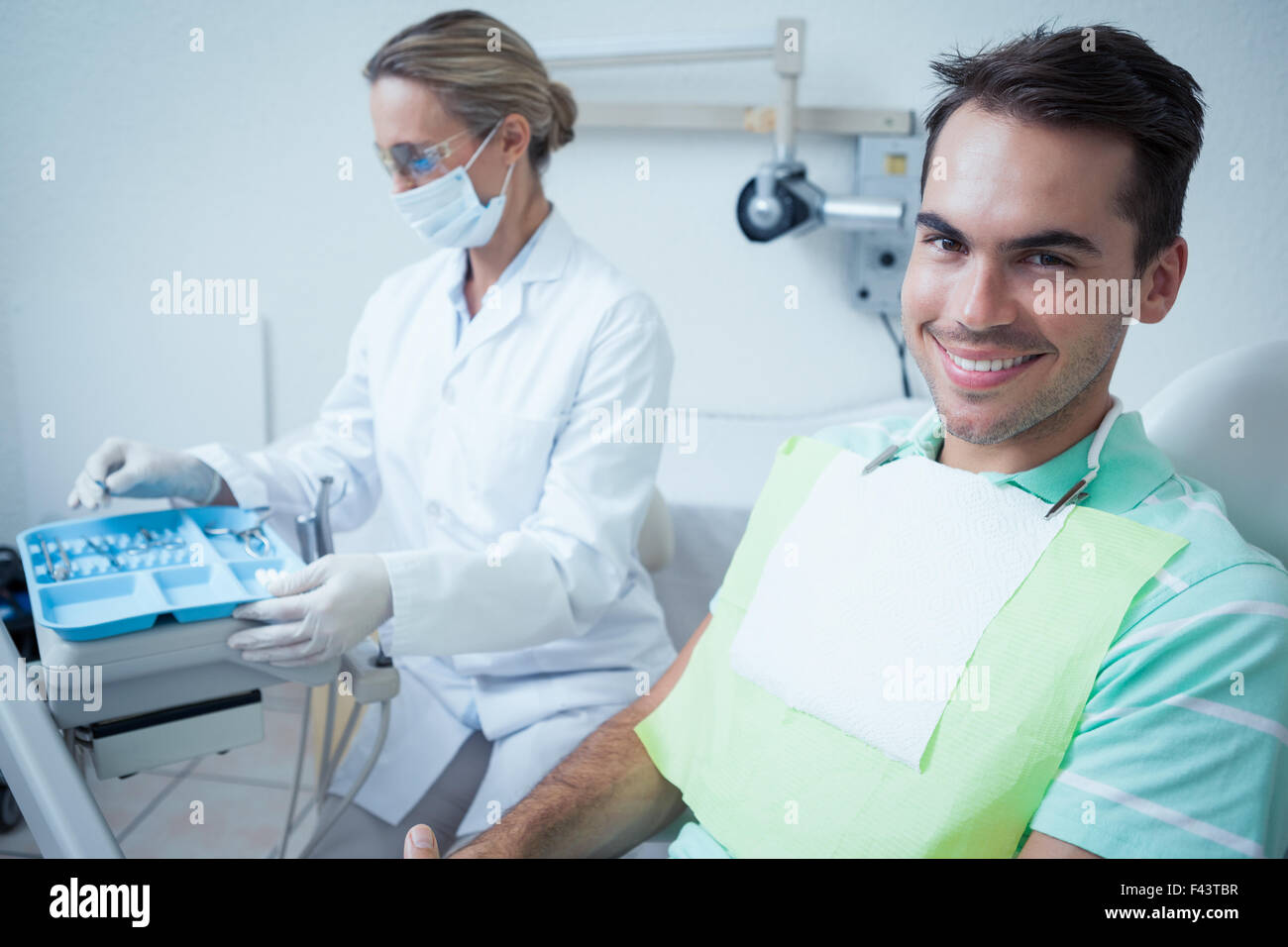 Smiling man waiting for dental exam Stock Photo